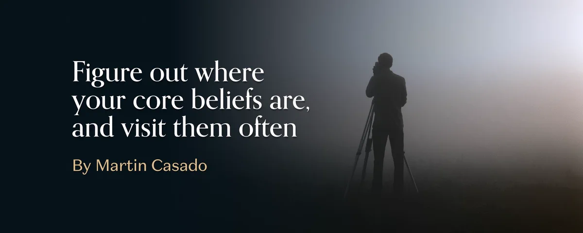 Article cover: a silhouetted figure behind a camera on a tripod in fog, beside the words Figure out where your core beliefs are, and visit them often. By Martin Casado